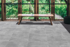 Wintergarten mit Terrassenplatten Betonoptik Grau